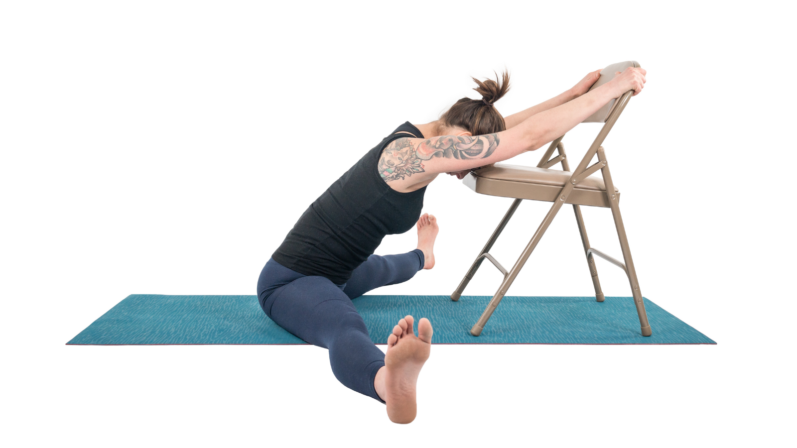 Practicing yoga's forward folds with a chair to support your arms and legs. 