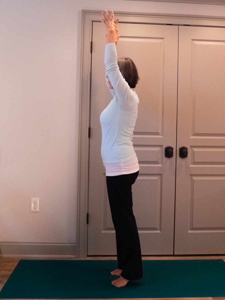 Mountain Pose with arms overhead variation, a beginner-friendly balance pose