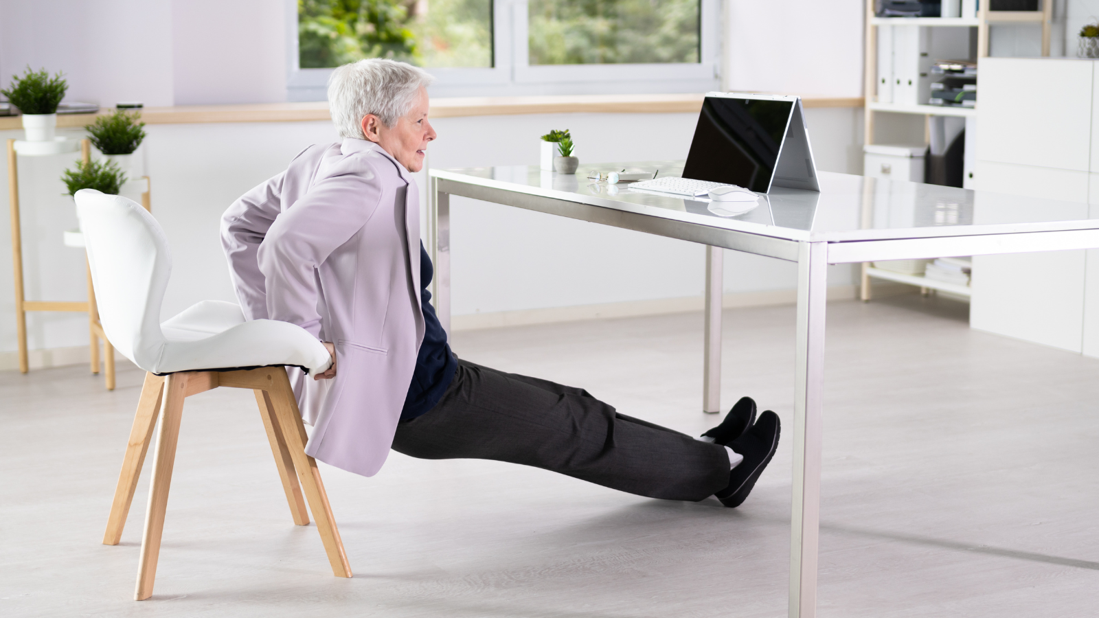 Chair Yoga at the office counteracts too much sitting while also increasing strength and flexibility that can help reduce pain.