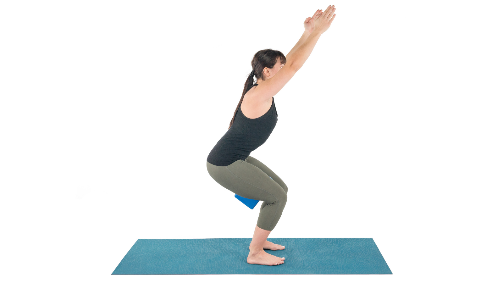 Chair Pose or Utkatasana with a block between the legs for greater strength and stability and pelvic floor health
