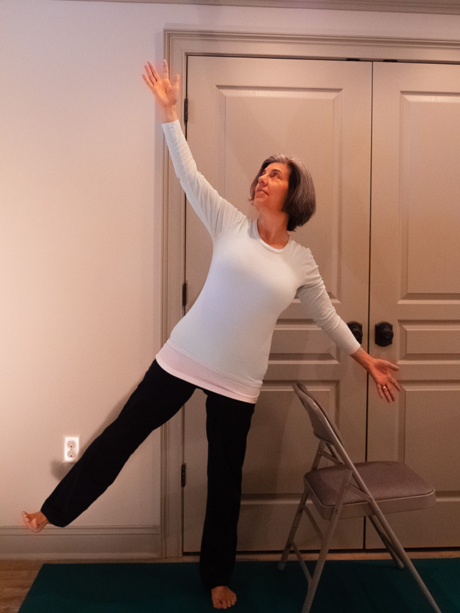 Balancing Star Pose, a beginner-friendly balance pose, with the gaze moving from straight ahead to the ceiling