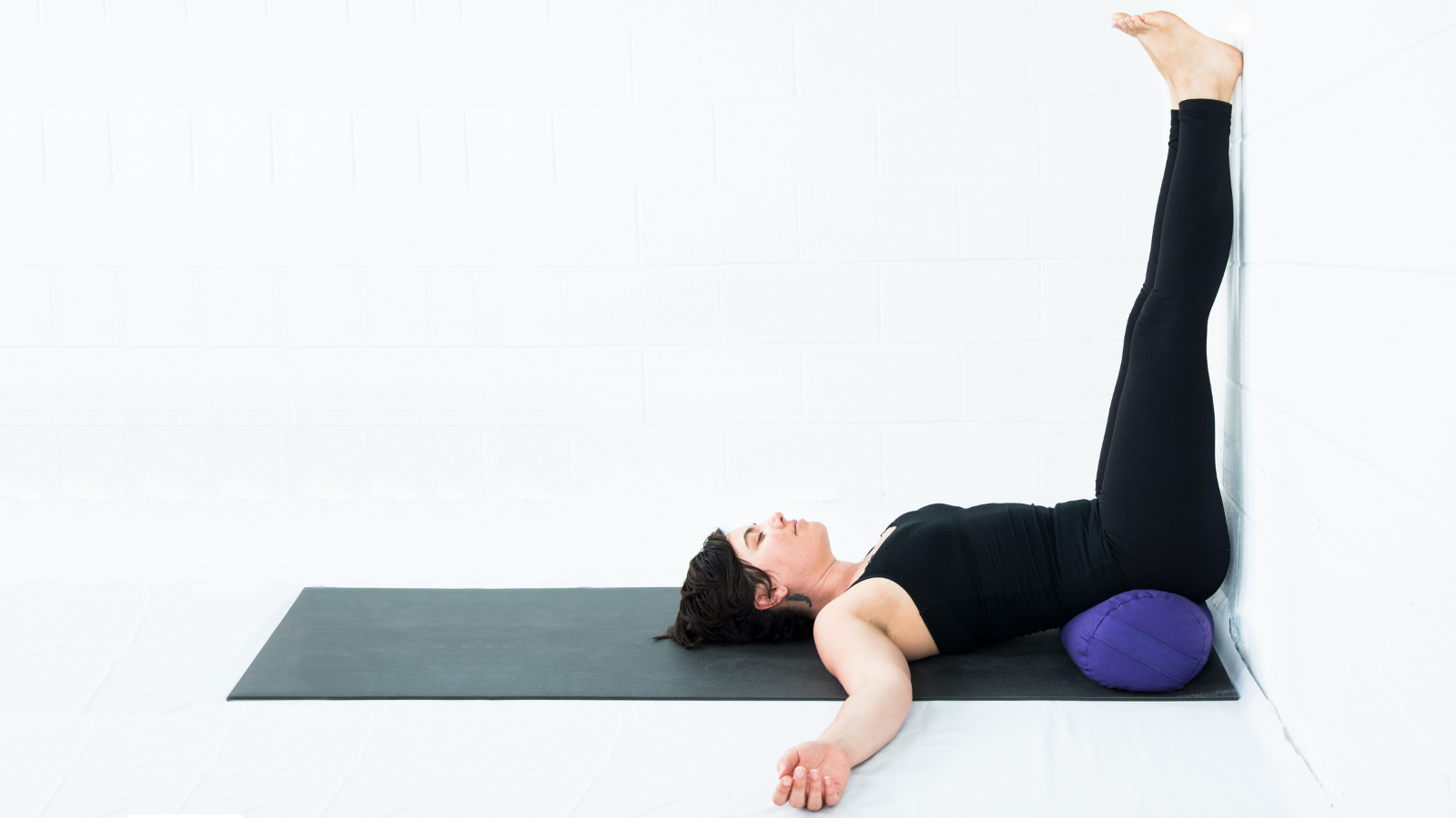 Image of woman practicing Legs Up the Wall Pose