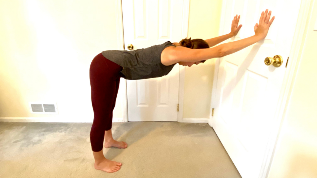 Down Dog Yoga Pose Practiced at the wall