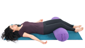 Woman Practicing Savasana (Corpse Pose) Yoga